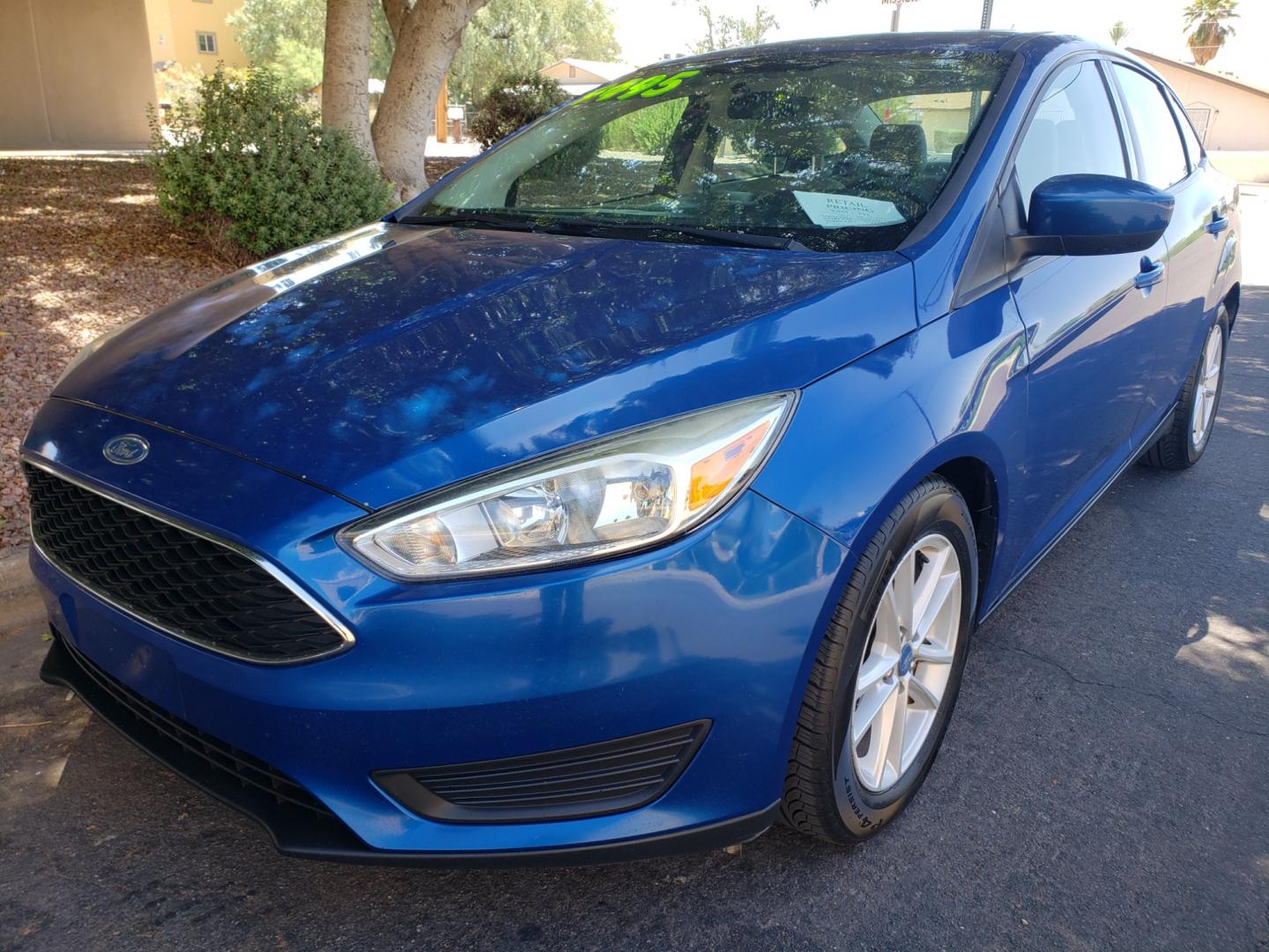 2018 /Tan and black Ford Focus SE Sedan (1FADP3F25JL) with an 2.0L L4 DOHC 16V engine, located at 323 E Dunlap Ave., Phoenix, AZ, 85020, (602) 331-9000, 33.567677, -112.069000 - Photo#0