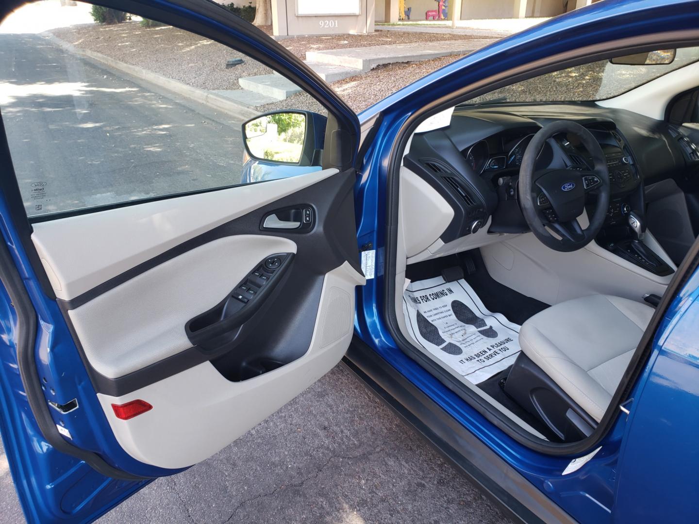 2018 /Tan and black Ford Focus SE Sedan (1FADP3F25JL) with an 2.0L L4 DOHC 16V engine, located at 323 E Dunlap Ave., Phoenix, AZ, 85020, (602) 331-9000, 33.567677, -112.069000 - Photo#8