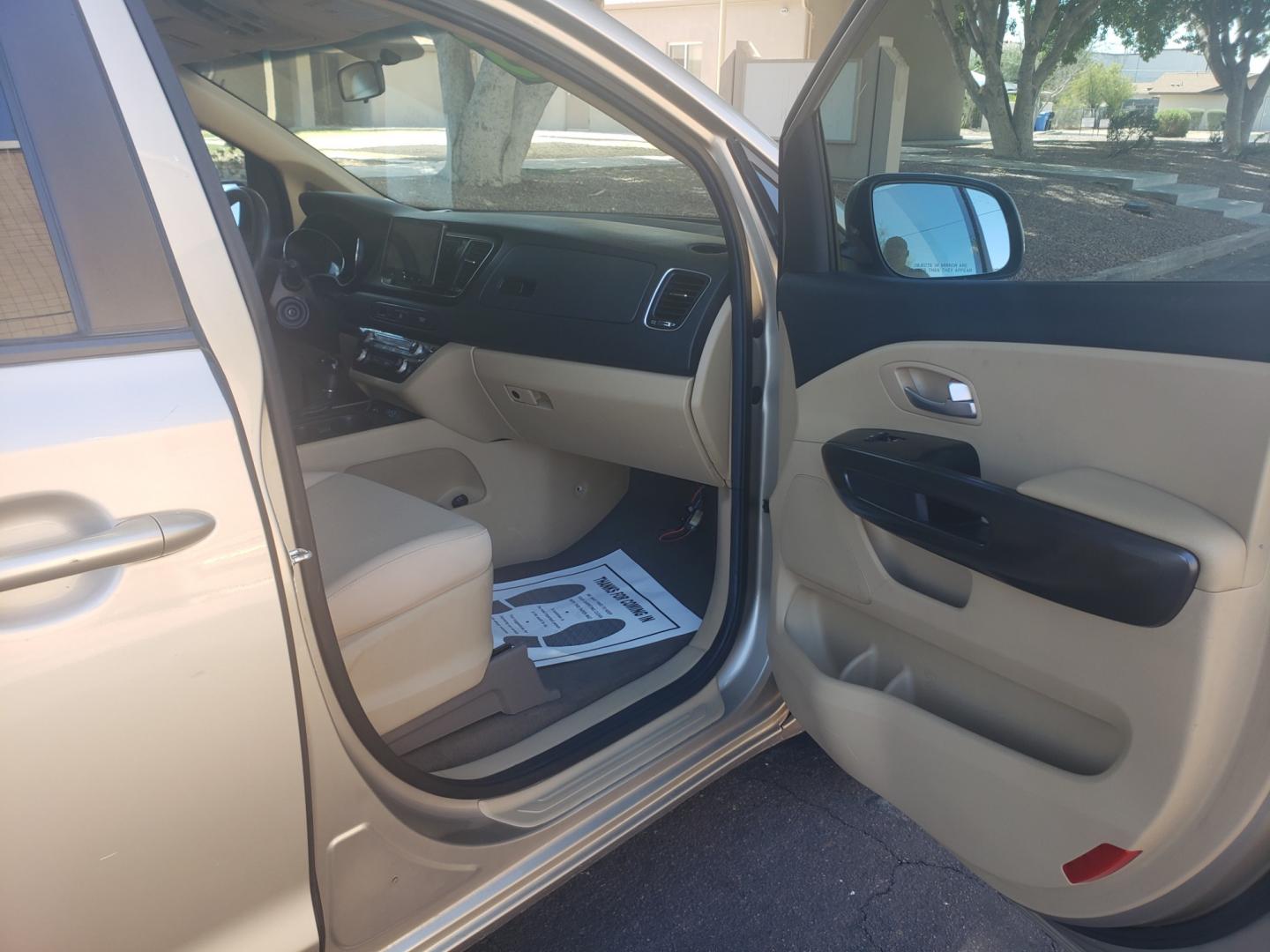 2016 /Tan and black Kia Sedona lx (KNDMB5C16G6) with an 3.3l v6 engine, 6-Speed Automatic transmission, located at 323 E Dunlap Ave., Phoenix, AZ, 85020, (602) 331-9000, 33.567677, -112.069000 - 2016 Kia Sedona LX,......EXCELLENT condition,..... A Real Must See!!.... No accidents, Clean inside and out, Power everything, Ice cold ac, Third row seating, Rear ac second and third seats, Clean Tan and black interior with Tan cloth seats in near perfect condition and the van is gorgeous. Touch sc - Photo#12