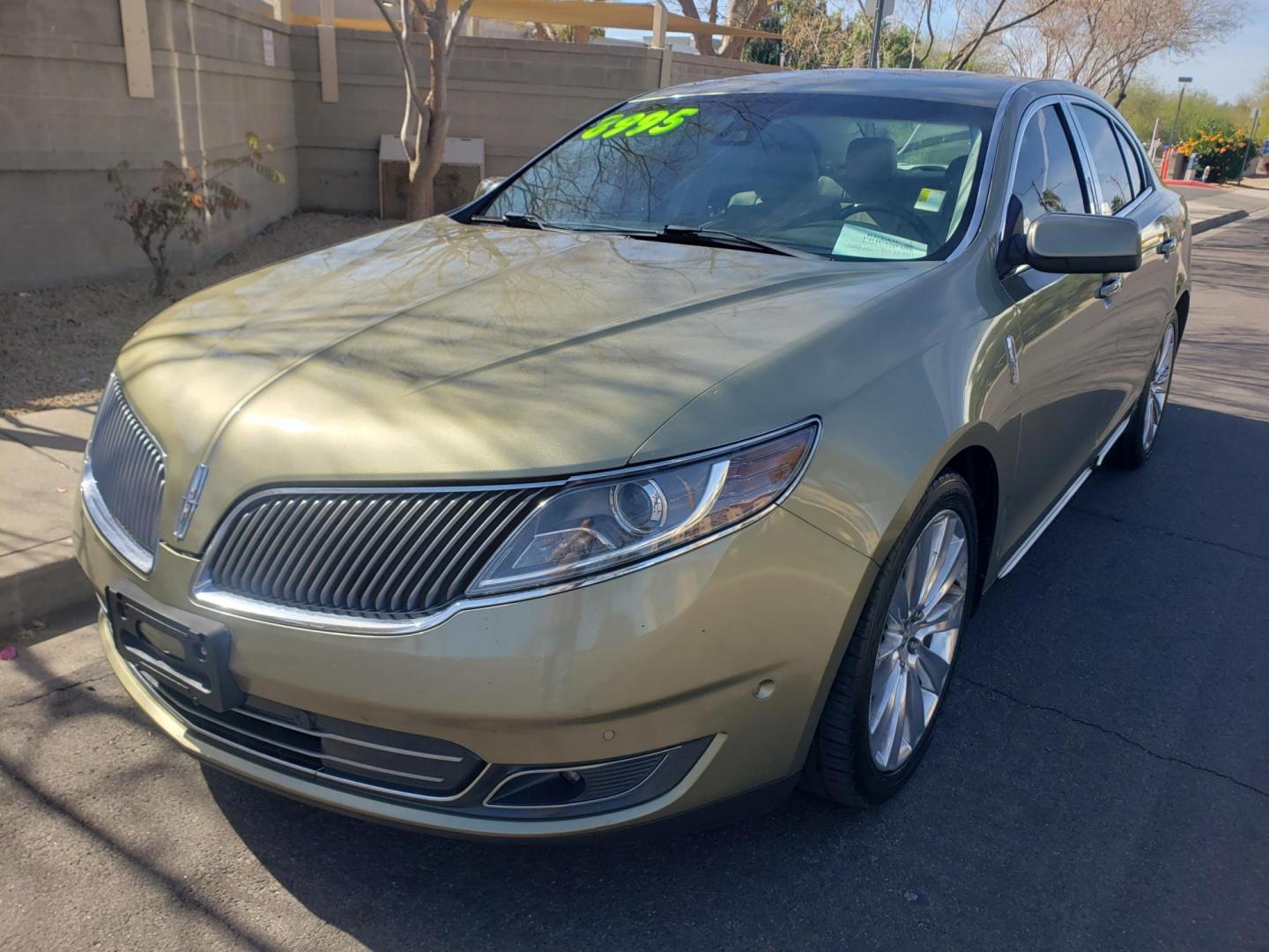 2013 gold /Tan and black Lincoln MKS EcoBoost AWD (1LNHL9FT6DG) with an 3.5L V6 DOHC 24V engine, 6-Speed Automatic transmission, located at 323 E Dunlap Ave., Phoenix, AZ, 85020, (602) 331-9000, 33.567677, -112.069000 - Photo#0