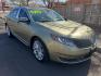 2013 gold /Tan and black Lincoln MKS EcoBoost AWD (1LNHL9FT6DG) with an 3.5L V6 DOHC 24V engine, 6-Speed Automatic transmission, located at 323 E Dunlap Ave., Phoenix, AZ, 85020, (602) 331-9000, 33.567677, -112.069000 - Photo#2